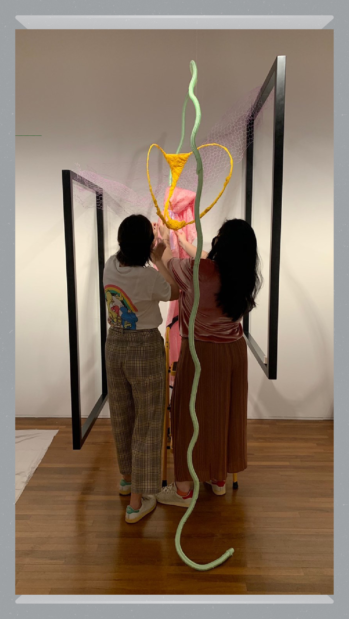 Stephanie and curator for ‘Time Passes’ Samantha Yap installing ‘Dressing a Window’
