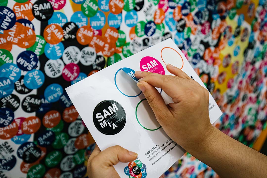 Circular stickers for audiences to co-create the artwork.