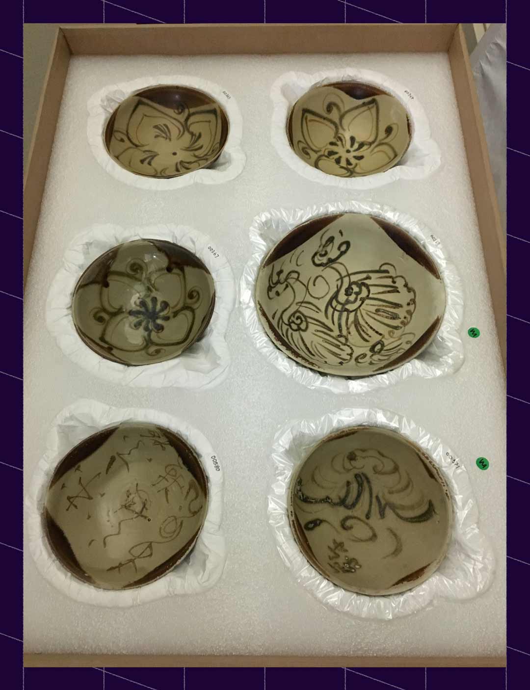 Ceramic bowls packed in a box of foam with individual beds carved to their shape 