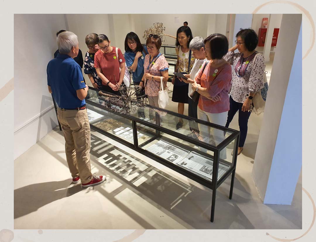 Mr Ling guiding a tour during Singapore Biennale 2019