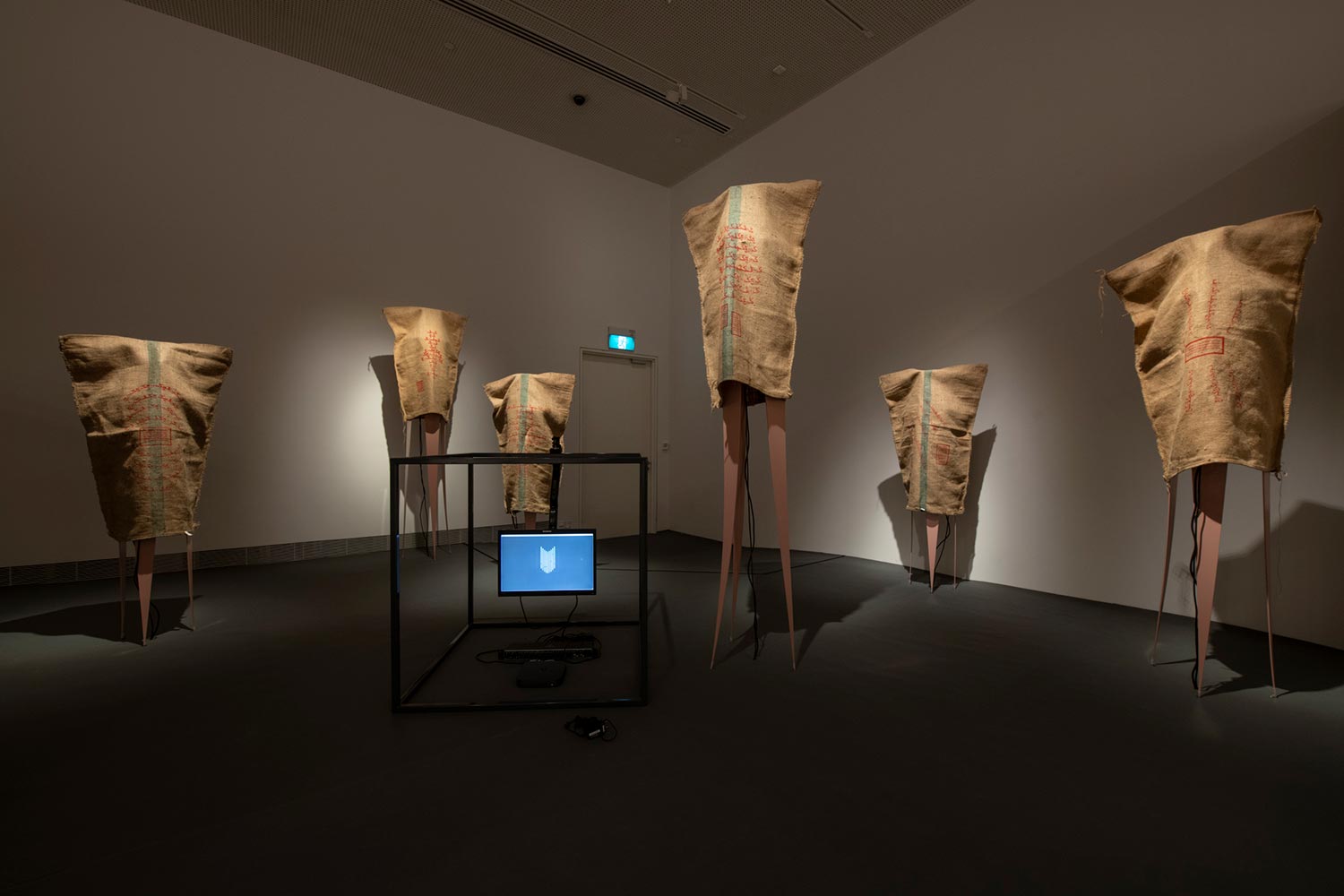 bani haykal. 'momok elektrik.' 2021. Nine-channel sound installation, gunny sacks, and steel frame documentation. Dimensions variable. Collection of Singapore Art Museum. Image courtesy of Singapore Art Museum.