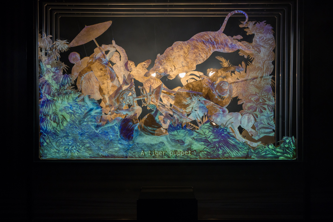 Ho Tzu Nyen, 'One or Several Tigers', 2017. Synchronised double-channel HD projection, automated screen, shadow puppets, 10-channel sound, show control system, 33 min 33 sec. Installation view for the exhibition 'Ho Tzu Nyen: Time & the Tiger', SAM at Tanjong Pagar Distripark, 24 Nov 2023‒3 Mar 2024. Image courtesy of Singapore Art Museum.