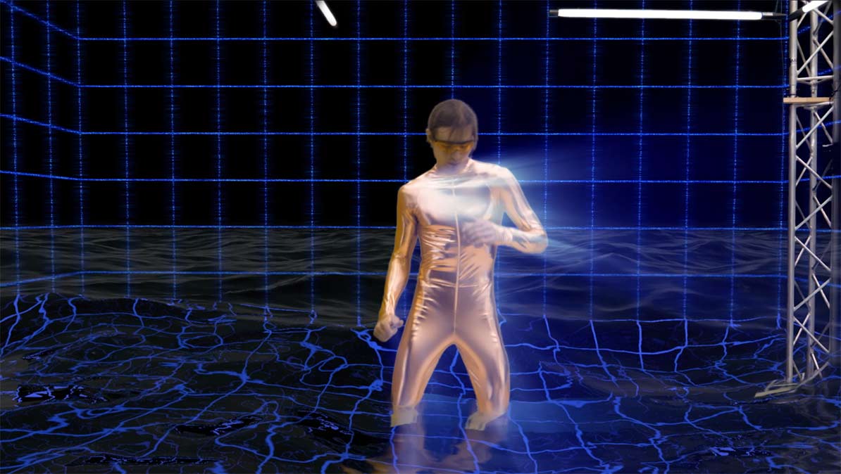 Hito Steyerl. ‘Factory of the Sun’ (still). 2015. Single channel high-definition video (colour, sound), environment, luminescent LED grid, beach chairs. Collection of Singapore Art Museum. Screenshot by the author. Film still © Hito Steyerl.