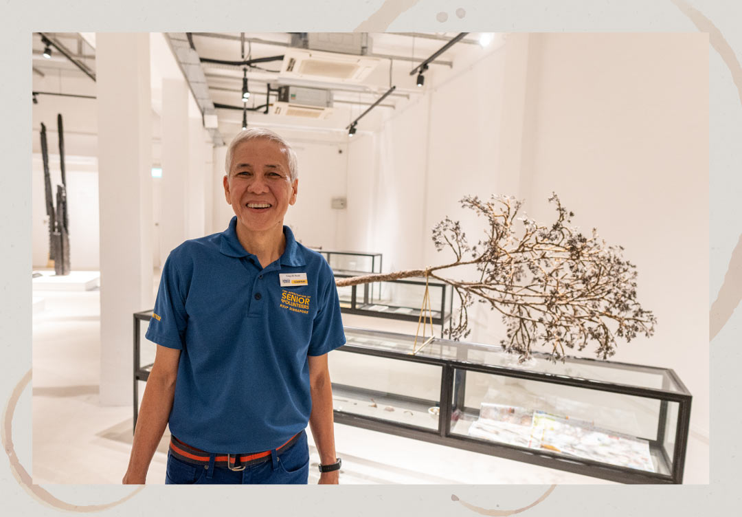 Mr Ling in front of Ruangsak Anuwatwimon’s Reincarnations (Hopea Sangal and Sindora Wallichii) during Singapore Biennale 2019