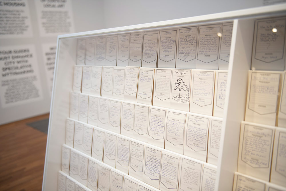 Debbie Ding. 'Here the River Lies.' 2010–2015. Ink on canvas and 1,500 hand-written cards in a specially crafted vitrine. Dimensions variable. Collection of Singapore Art Museum. Image courtesy of Singapore Art Museum.